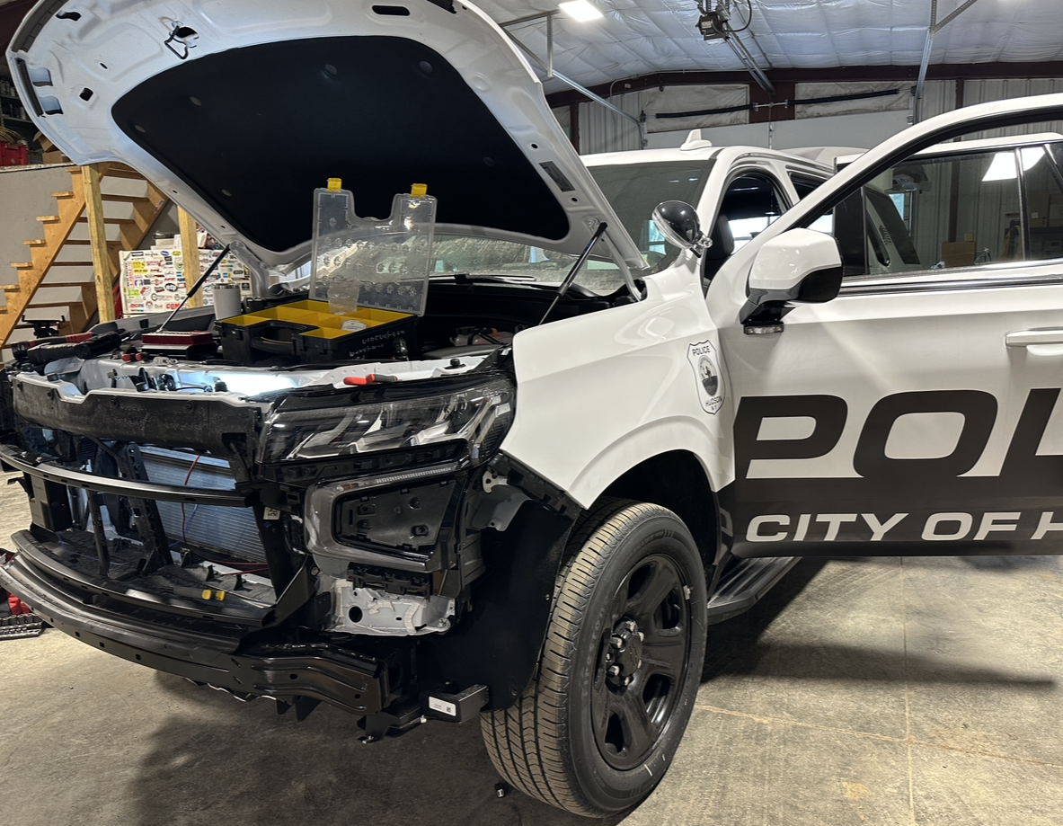 A picture of Aaron building a City of Hudson Police Cruiser.